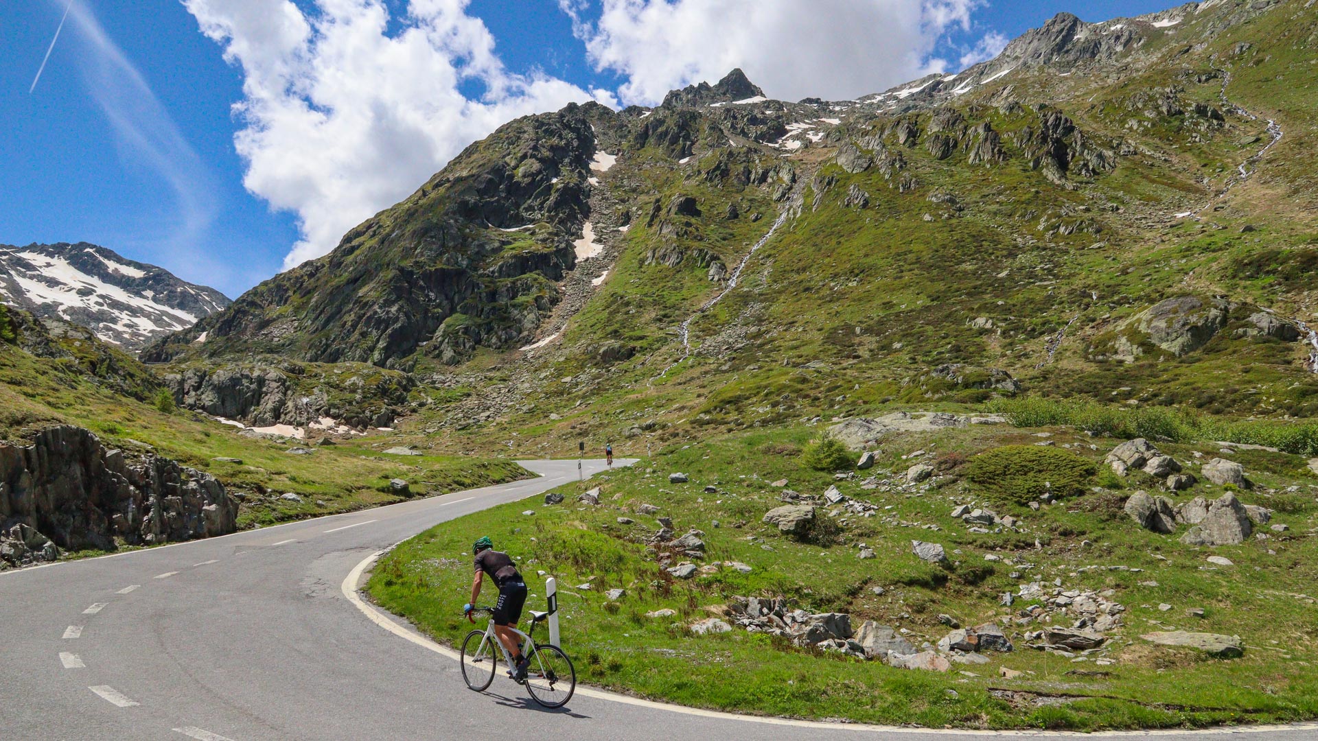 cyclist climbing the col of the Great Saint Bernard