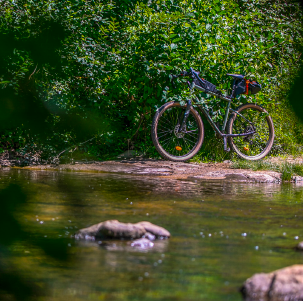 Bathing in a river during a gravel bike trip