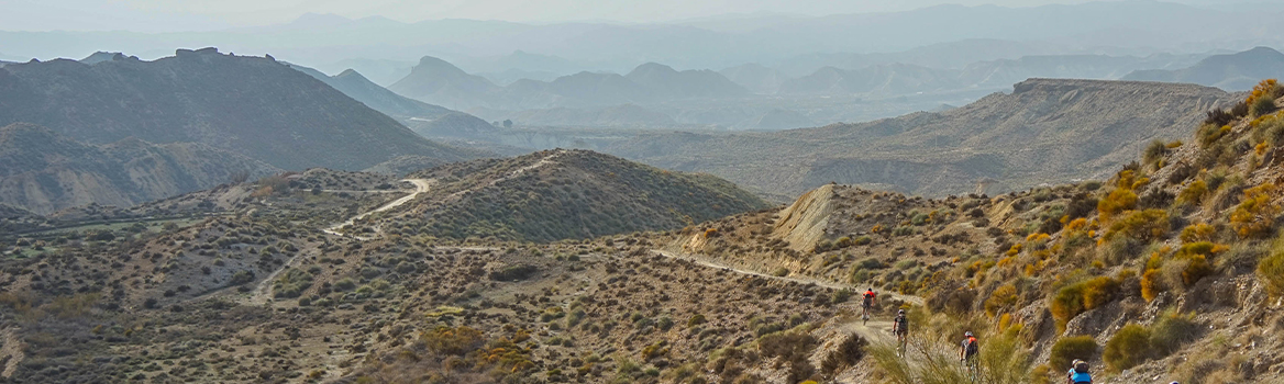 group of gravel cyclists in Tabernas desert in spain