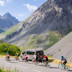 gravel bike group of cyclists with support vehicle